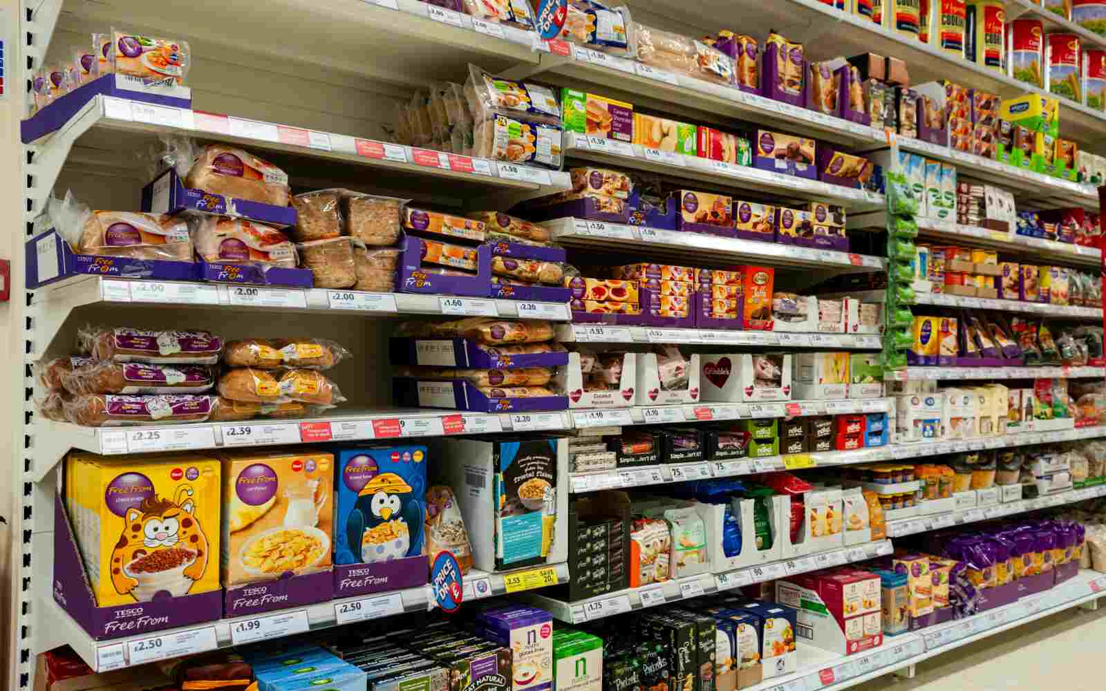 Shelves of gluten, dairy and nut free food on shelves in a grocery store